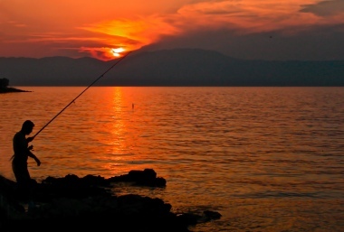 Pescatore al tramonto, di Patrix